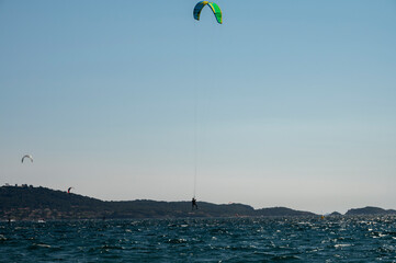 Hyeres, Almanarre beach, France, July 10, 2021. Extreem water sport - wing foil, kite surfing, wind surfindg, windy day on Almanarre beach near Toulon, South of France