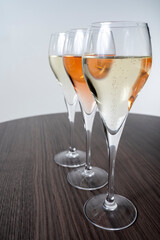Tasting of white and rose champagne sparkling wine from flute glasses