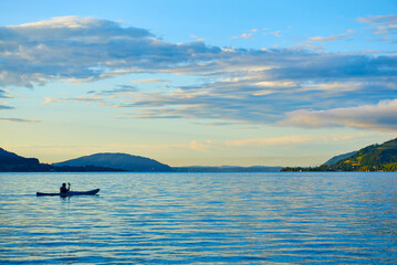 Fisherman on Lake Attersee. Austrian Alps, Salzburg region.