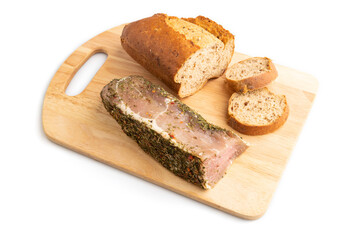 Bread with jerky salted meat on wooden cutting board isolated on white background. side view.