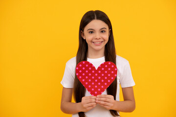 glad kid hold love heart on yellow background, valentine day