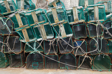 several pots for fishing in Asturias Spain stacked in the fishing port, capture of octopus and shellfish