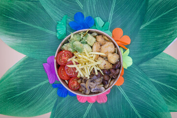Vegeterian seafood bowl with smoked salmon, shrimp, avocado in take out paper container. Close up, copy space, top view, background.