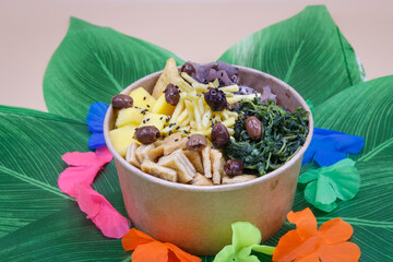 Vegeterian seafood bowl with smoked salmon, shrimp, avocado in take out paper container. Close up, copy space, top view, background.