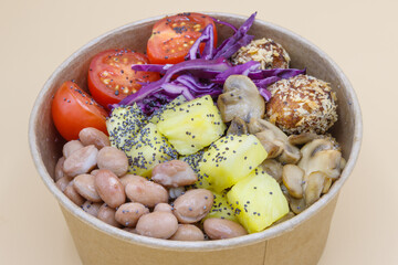 Vegeterian seafood bowl with smoked salmon, shrimp, avocado in take out paper container. Close up, copy space, top view, background.