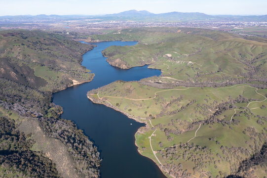 A reservoir lies nestled amid the hills and valleys of the Trivalley area of Northern California, just east of San Francisco Bay. This region is known for its vineyards and open space.