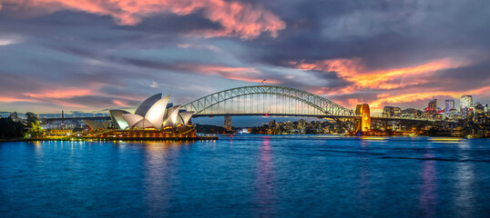Sydney Harbour Australia at Sunset with the turquoise colours of the bay and high rise offices of...