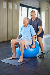 Just one more lift. Cropped shot of a handsome personal trainer with a senior man.