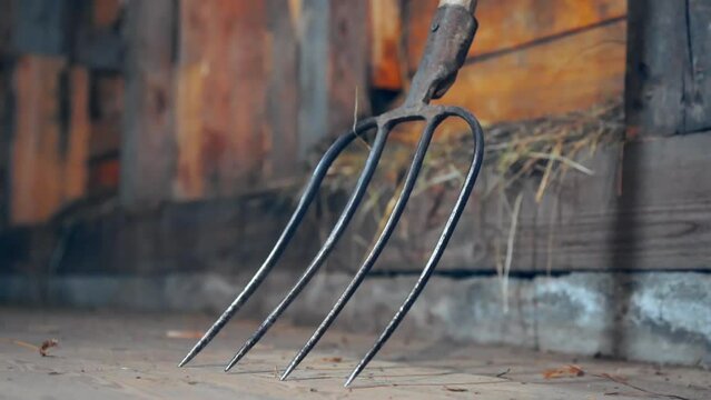 Farm tool pitchfork in barn