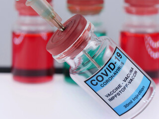 Symbolic picture Coronaserum-Covid 19- serum vial.