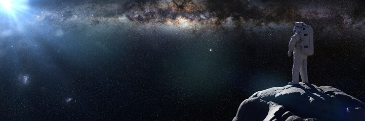 Fototapeta na wymiar astronaut watching the Milky Way galaxy 