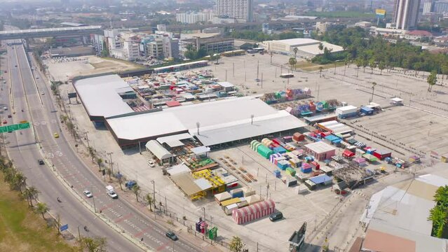 Aerial top view of Night Market people walking street, Colorful tents in the train of Ratchada at Bangkok city, Thailand. Retail shops
