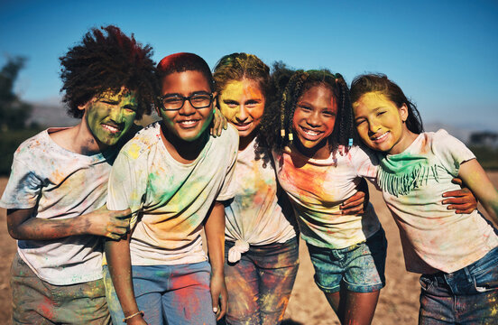 Friends fill your life with color. Shot of a group of teenagers having fun with colourful powder at summer camp.