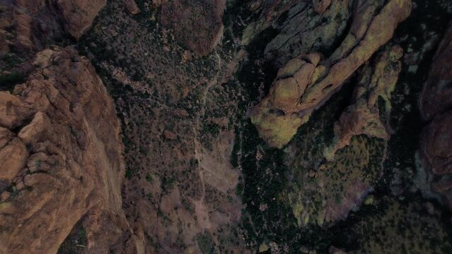 Aerial Over Siphon Draw Trail with Slow Tilt Up to Reveal Flatiron Peak