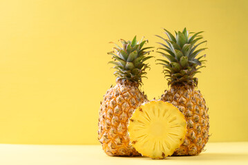 Fresh pineapple fruit on yellow background, Tropical fruit