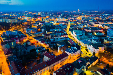 Aerial view of illuminated streets and buildings at night, Rzeszow, Poland