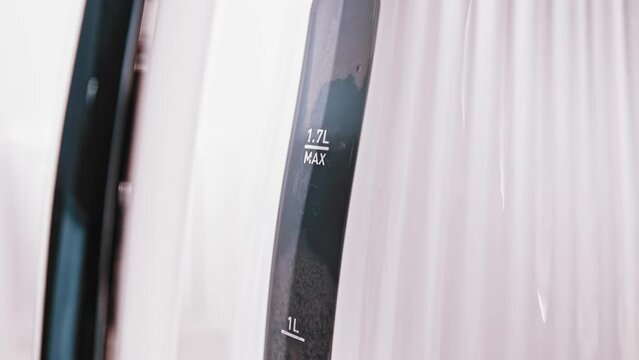 Water Reaching Boiling Point Creating Bubbles on Scale of Kitchen Electric Kettle