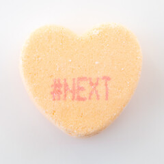 Conversation hearts on white background flat lay.