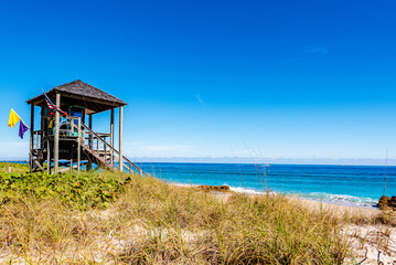 Lifeguard station with beach and ocean in Deerfield Beach, Florida. Clear Blue sky with empty space