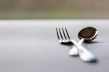 closeup of knife and fork on table top