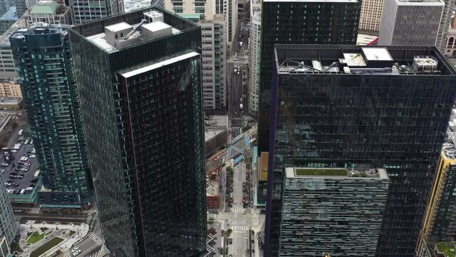 Aerial high above Seattle showcasing how small the streets are beneath the skyscrapers.