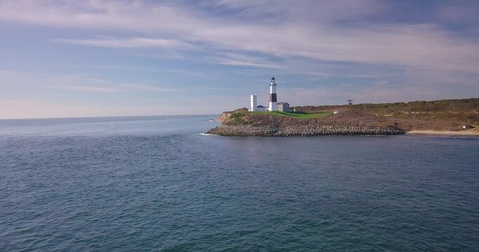 Picturesque aerial view flying toward the Montauk Point Lighthouse in East Hampton, New York.