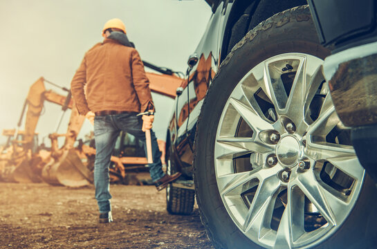 Construction Site Equipment and the Business Owner Next to His Truck