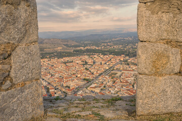 View of Nafplion framed by stone walls of the Palamidi fortress, Greece
