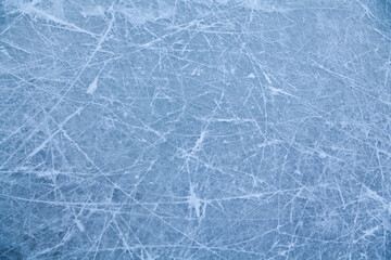 The surface of the ice is indented by skates.