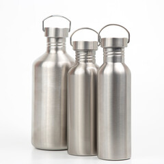 metal steel water flasks on white background. metal drinking utensils