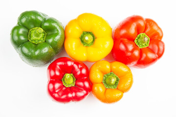 colored bell peppers on a white background. vitamin food