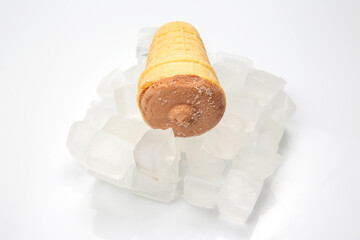 chocolate ice cream in a waffle cone glass in pieces of ice. dessert food