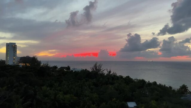 Beautiful sunset over the warm tropical ocean in Riviera Maya. Sunset over Caribbean sea in Cozumel, Mexico.