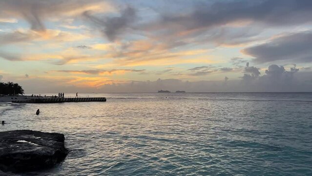 Beautiful sunset over the warm tropical ocean in Riviera Maya. Sunset over Caribbean sea in Cozumel, Mexico.