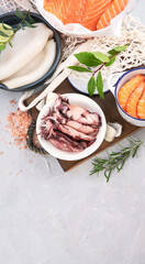 Fresh seafood arrangement on light background.