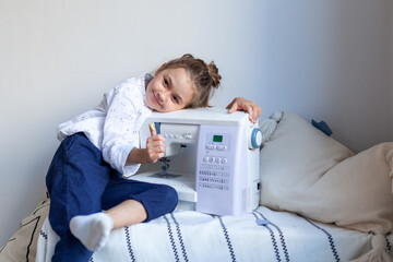 Girl learning to sew on a sewing machine