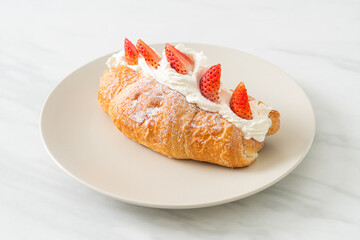 strawberry fresh cream croissant on plate