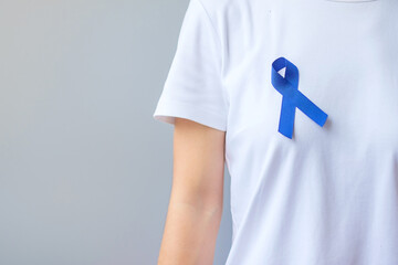 March Colorectal Cancer Awareness month,  dark Blue Ribbon for supporting people living and...