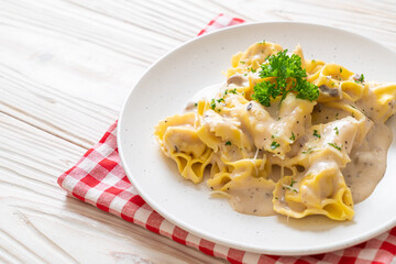 tortellini pasta with mushroom cream sauce and cheese