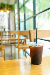 iced black coffee cup on table