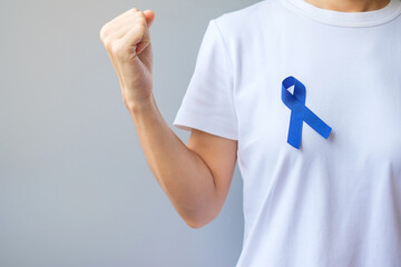 March Colorectal Cancer Awareness month,  dark Blue Ribbon for supporting people living and...