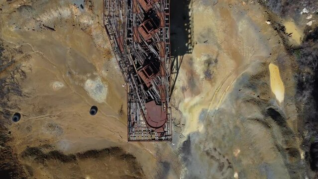 Bird's eye view of the rusted trolley track on top of the deserted Mitsero copper mines.