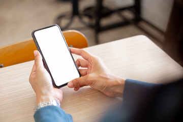 cell phone blank white screen mockup.hand holding texting using mobile on desk at office.background empty space for advertise.work people contact marketing business,technology