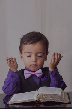 portrait of little man reading the word of God