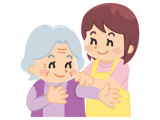 高齢女性に更衣介助を行う介護士　ヘルパー