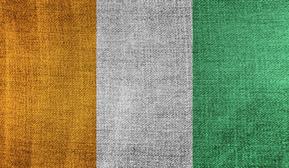 Fototapeta premium Côte d'Ivoire flag on knitted fabric. 3D-image