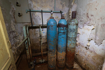 old gas cylinders in the basement. bomb shelter equipment. abandoned bomb shelter in a terrible...