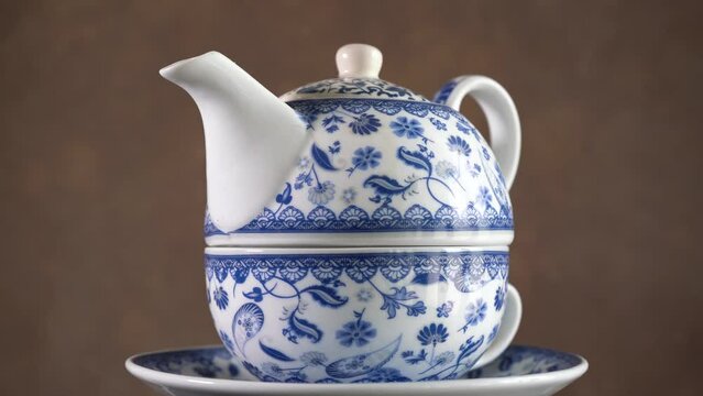 Rotating Double Handle Ceramic Teapot. Close Up
