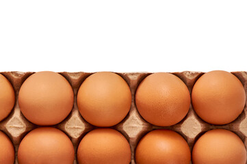 Eggs on a cardboard stand on a white insulated background