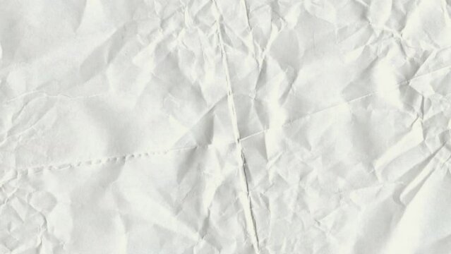 Video background, light yellowish white colored wrinkled paper texture background.